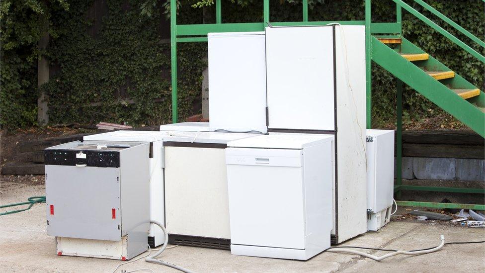 Discarded white goods at recycling centre