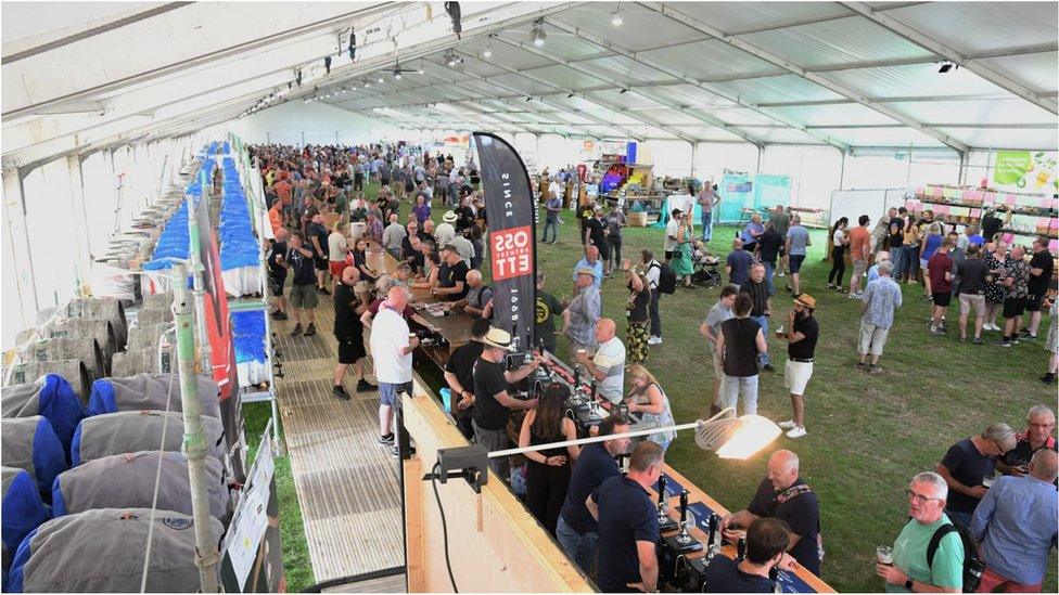 People line up for beer at the festival