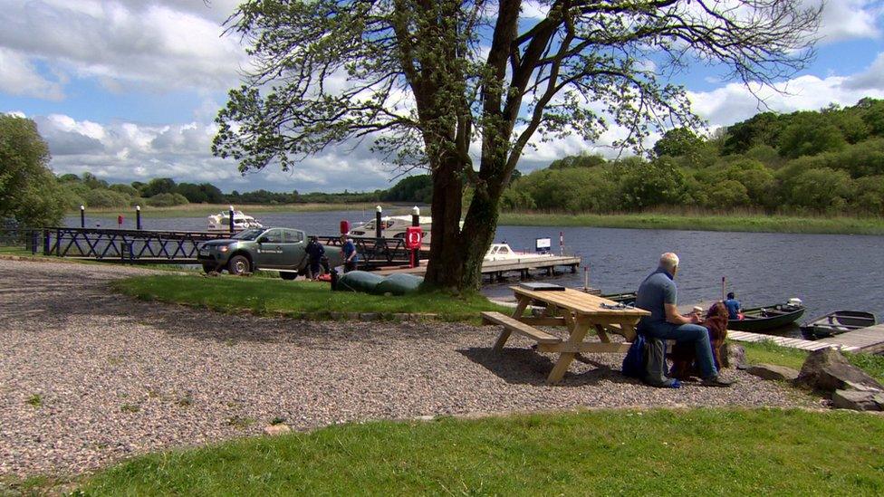 Boaters on the shore of Lough Erne