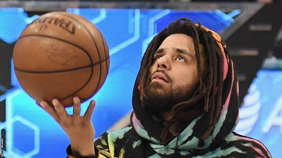 J Cole with basketball