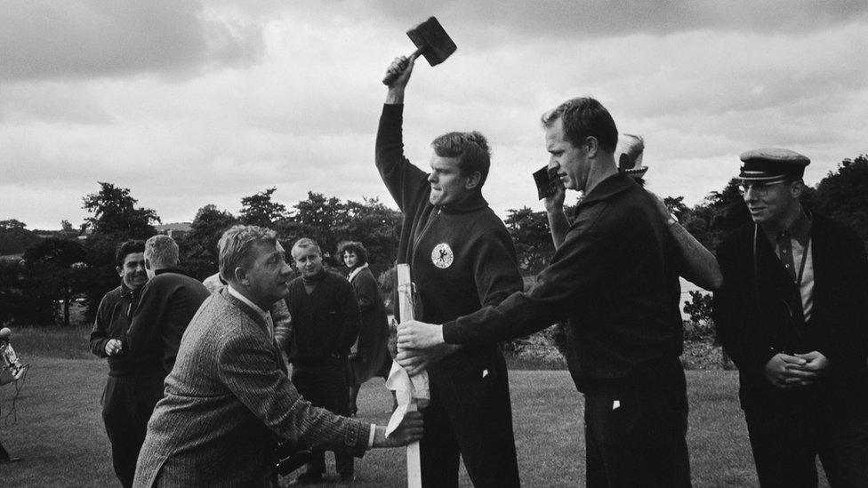 The West German football team constructing goalposts at their training ground in Ashbourne