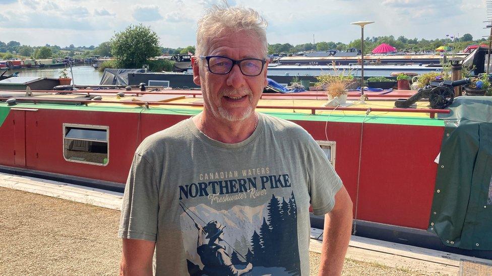 Boat Dweller Anthony Van Rood who lives standing in front of boats moored at Caen Hill Marina