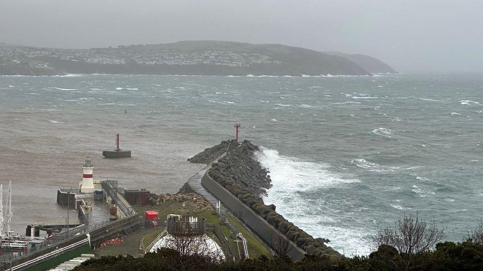 Waves crashing on Douglas breakwater