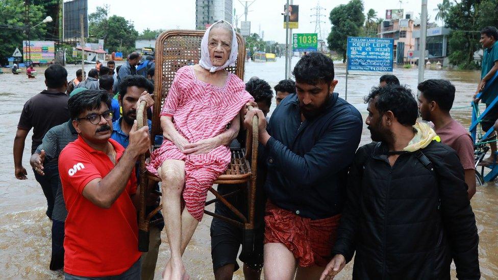 Indian volunteers and rescuers evacuate local residents in Ernakulam district - 17 August