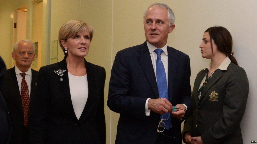 Malcolm Turnbull (C) leaves the Australian Federal Liberal party room with Julie Bishop (left) after winning the leadership, at Australian Parliament House, 14 September 2015.