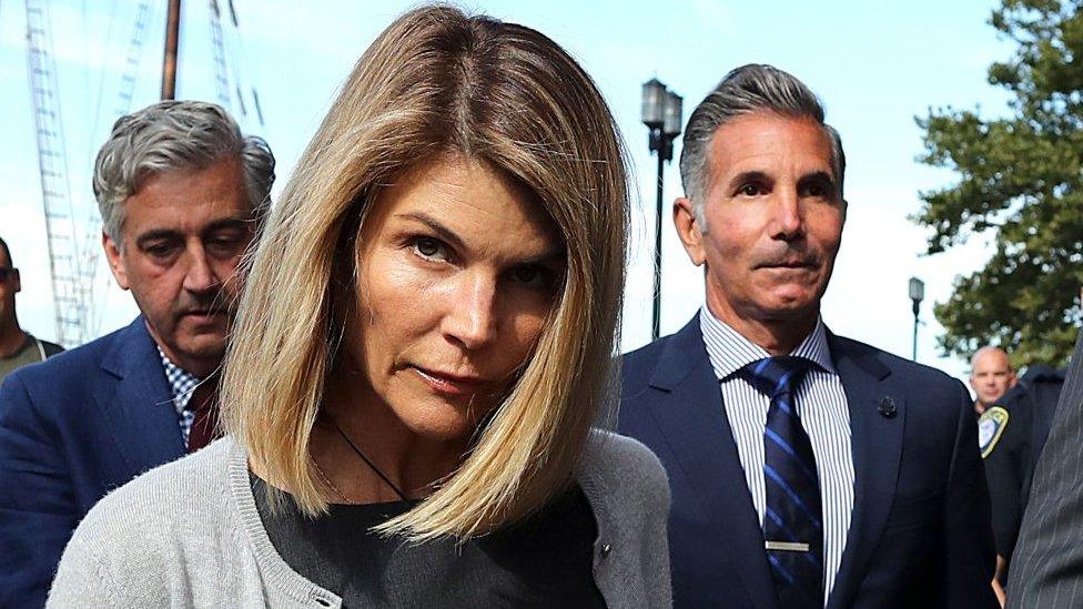 Lori Loughlin and her husband Mossimo Giannulli, right, leave the John Joseph Moakley United States Courthouse in Boston on Aug. 27, 2019