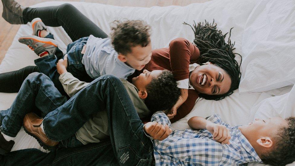 Octavia Reese plays with her three sons