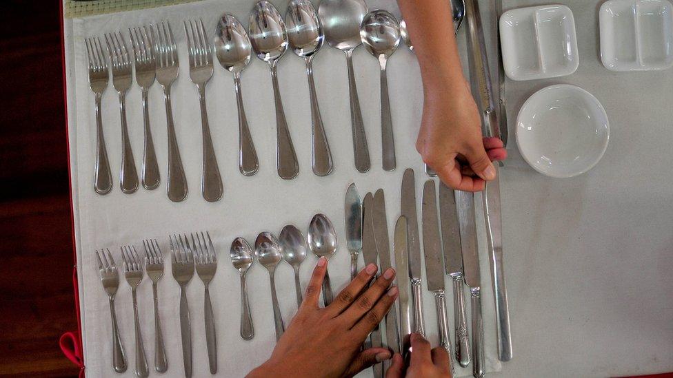 Filipino trainees are tested on their skill on housekeeping as part of their requirement before working abroad on September 10, 2013 in Manila, Philippines.