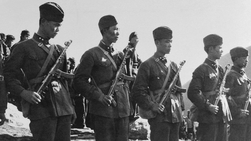 Chinese troops are shown standing guard near the Tibet border