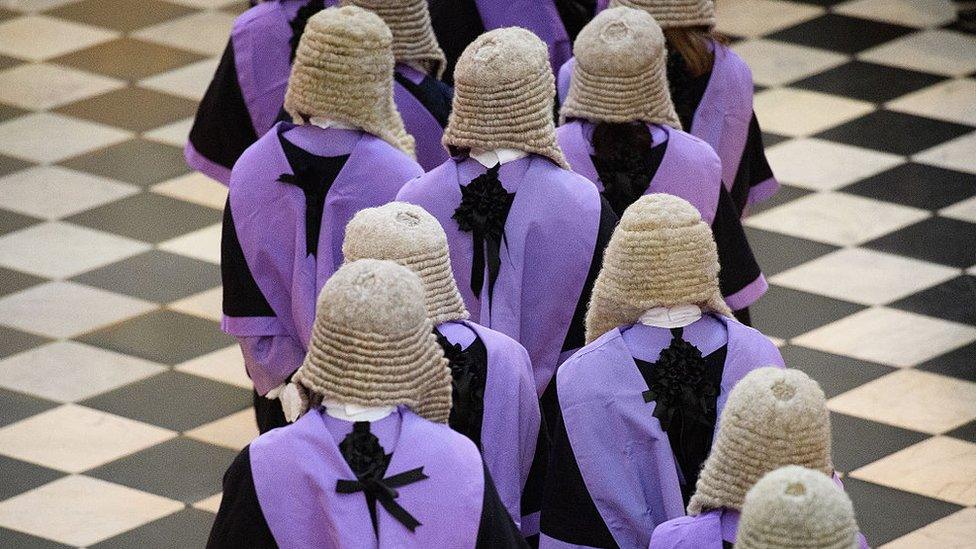 Judges and members of the legal profession take part in a procession inside Westminster Abbey