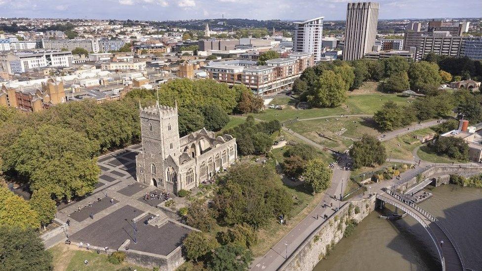 An aerial view of Castle Park with the ruined St Peter's Church in the middle