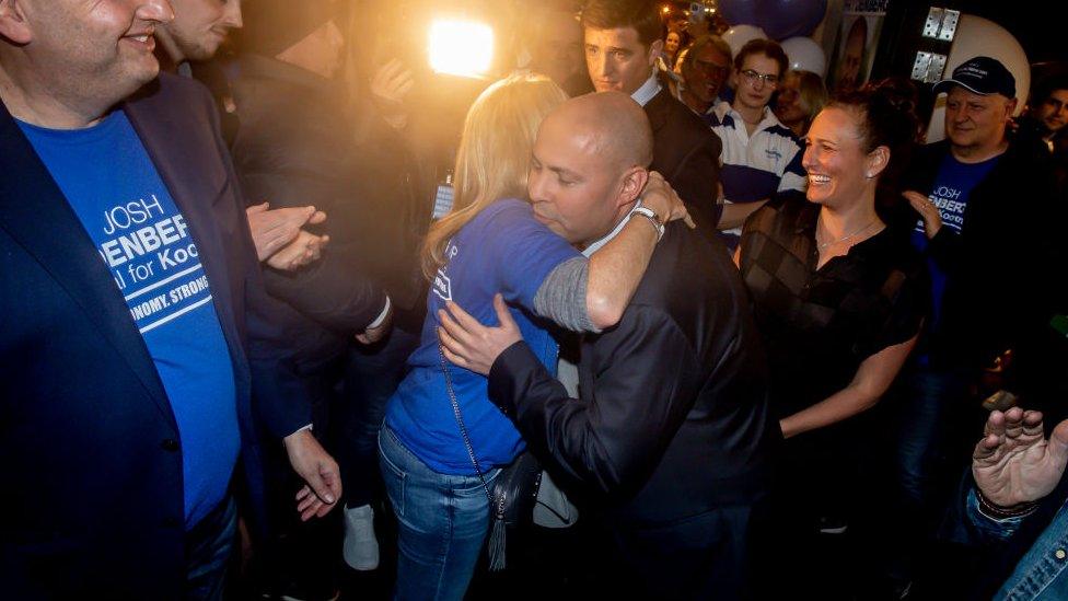 Josh Frydenberg hugs a supporter