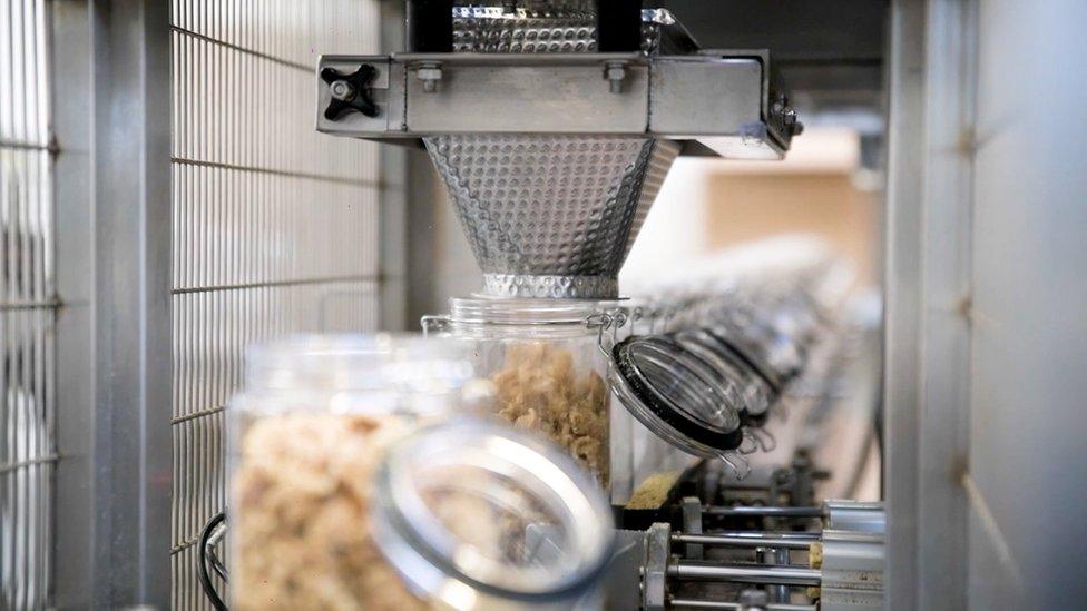 Snacks on production line being bottled