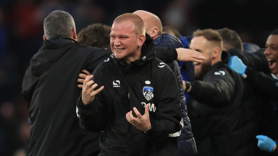 Peter Wild celebrates Oldham win over Fulham.