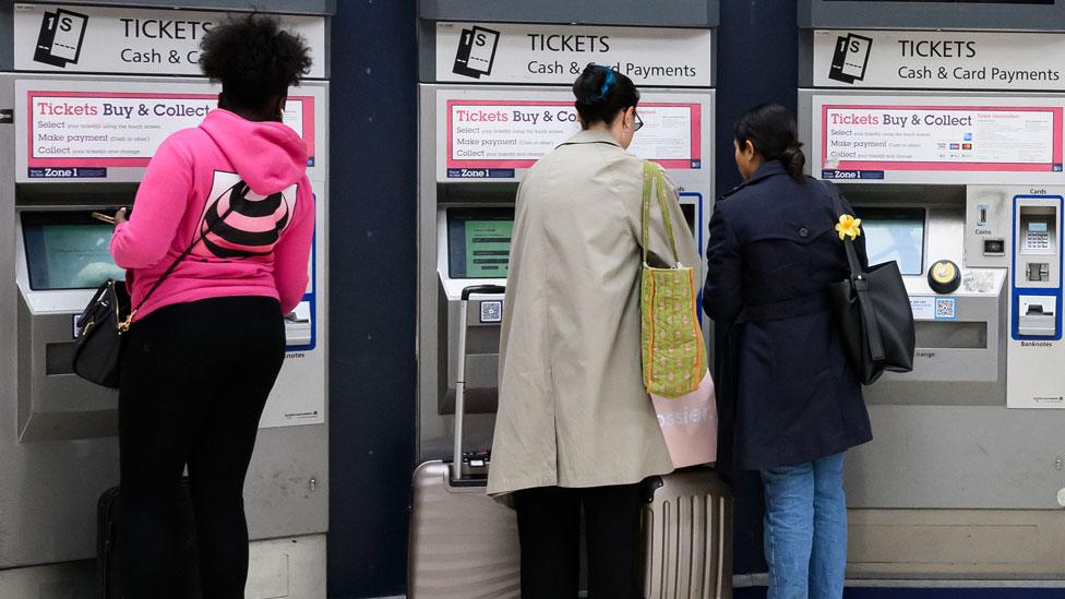 Passengers purchase rail tickets from self-service machines in Victoria Station on 5 July 2023 in London, England