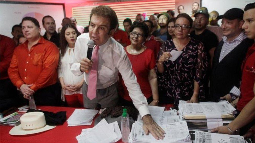 Salvador Nasralla, presidential candidate for the Opposition Alliance Against the Dictatorship, shows the tallies of ballot counting during a news conference in Tegucigalpa, Honduras November 29, 2017.