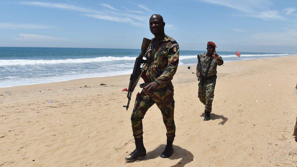 Soldiers patrol the beach in Ivory Coast
