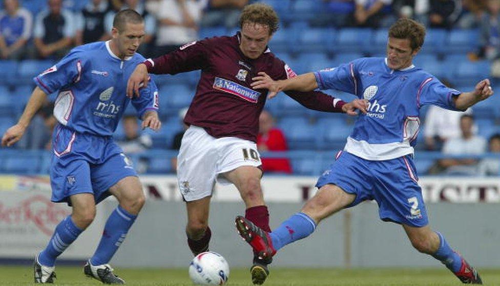 Sam Aiston of Northampton Town takes on Duncan Jupp (R) and Andrew Crofts of Gillingham during the Coca Cola League One match between Gillingham and Northampton Town at Priestfield Stadium on August 18, 2006 in Gillingham, England.