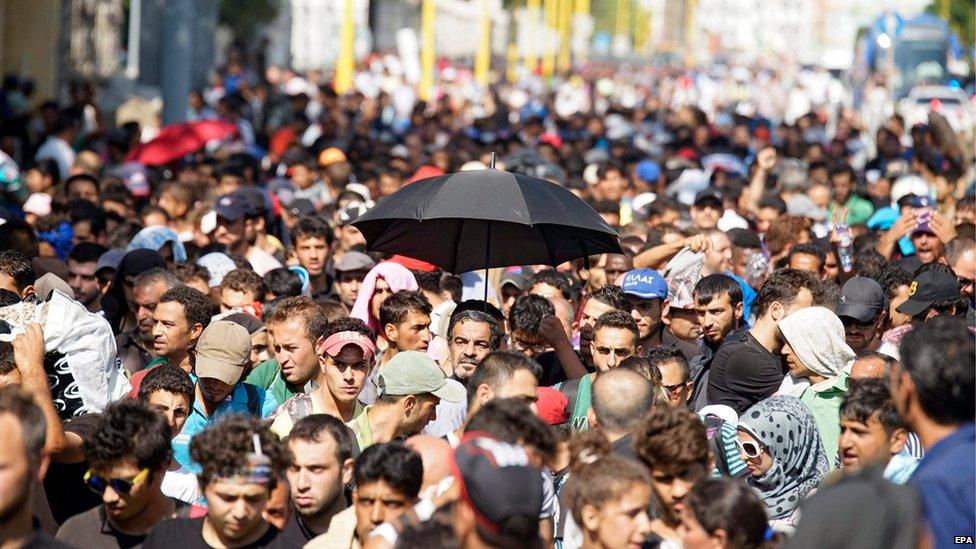 Migrants set off on foot for the border with Austria from Budapest, Hungary, September 4, 2015