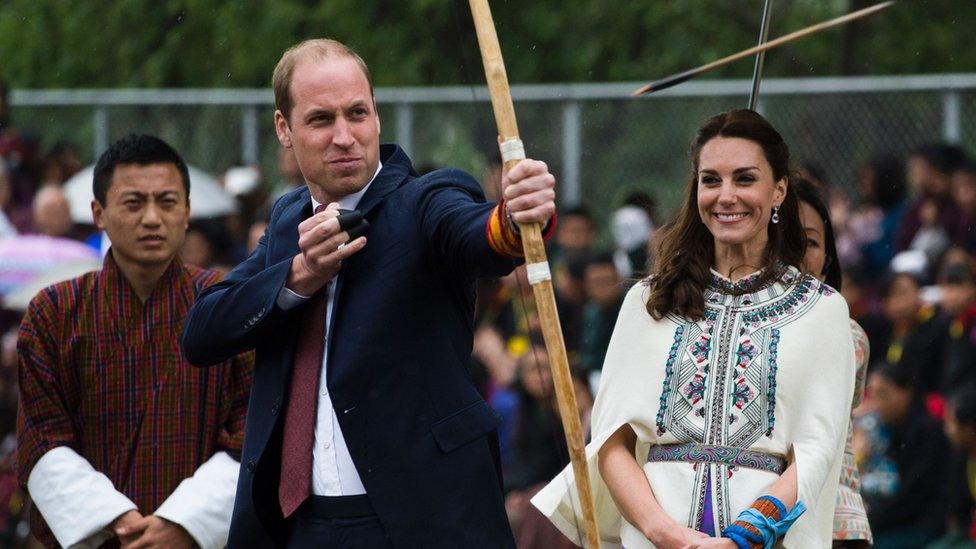 Prince William firing an arrow