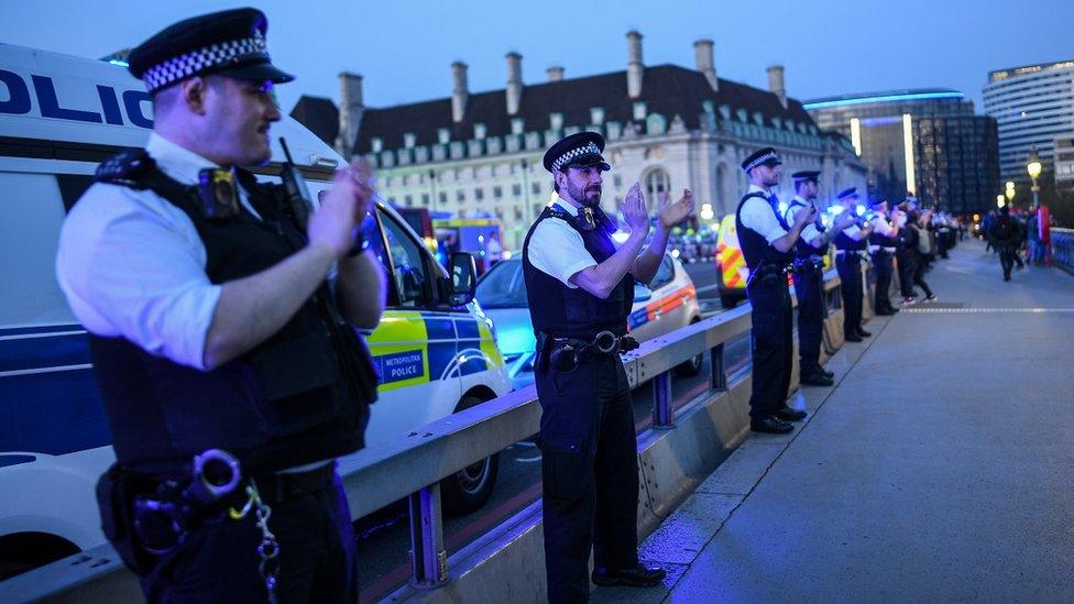 Picture of clapping police officers on bridge