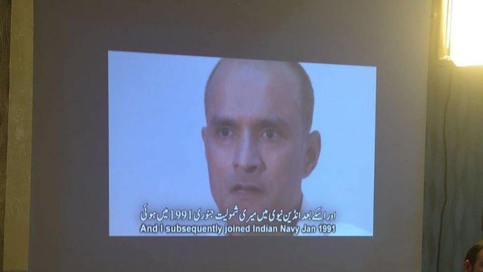 Members of the media watch a projection of a video showing arrested man Kulbhushan Jadhav, who is suspected of being an Indian spy, during a press conference in Islamabad on 29 March 2016