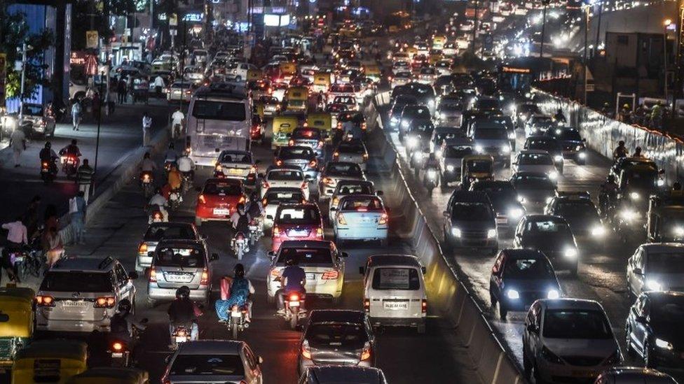 In this photo taken on October 15, 2015, commuters in their vehicles clog a busy artery in southern New Delhi