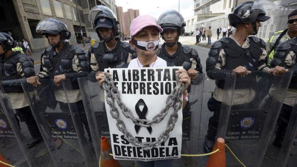 A woman takes part in a protest outside the CADIVI headquarters in Caracas in February 2013. About 500 newspaper workers demanded to the government the release of US dollars to buy paper, presently in shortage in Venezuela