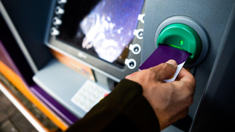 Man using a cash machine