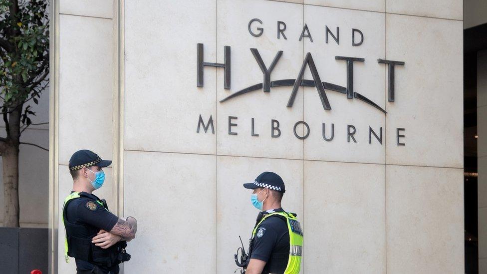 Police guard quarantining tennis players inside the Grand Hyatt Melbourne in Australia