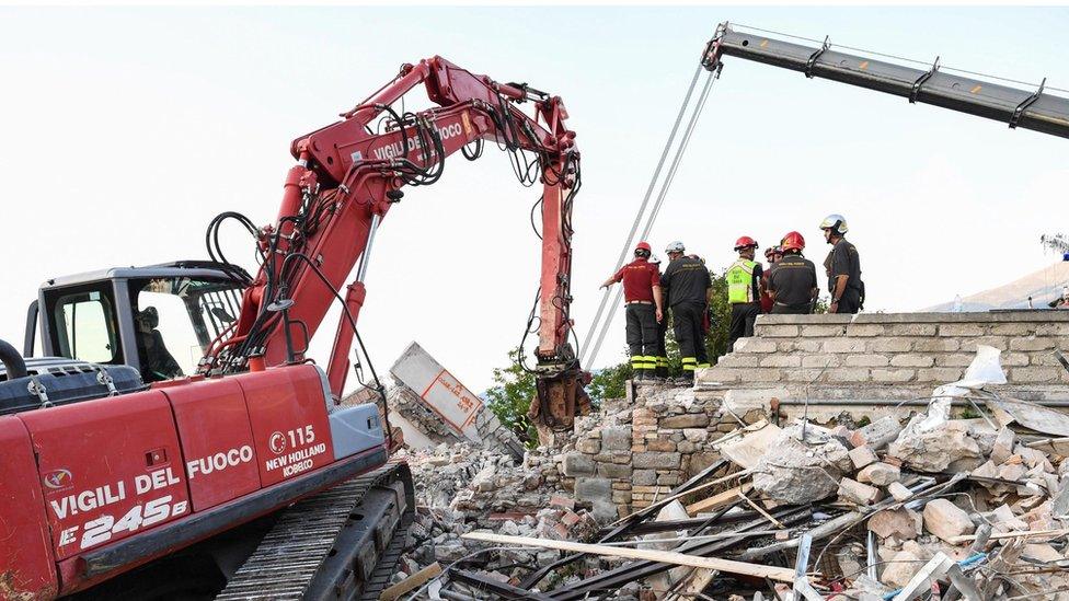 Rescuers search rubble in Amatrice, 1 September