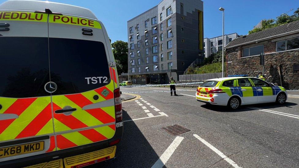 Police cordon and vehicles around the Strand