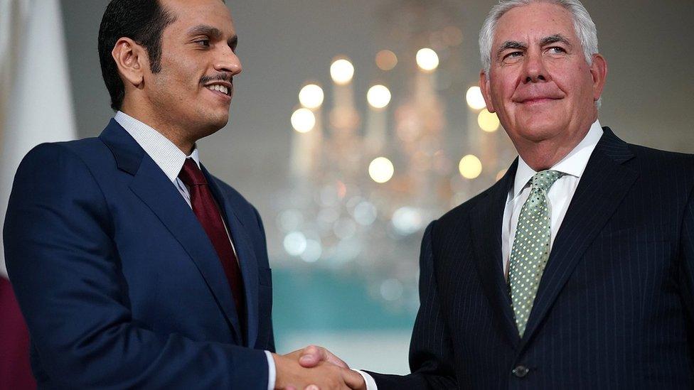 Qatari Foreign Minister Sheikh Mohammed Bin Abdul Rahman Al Thani shakes hands with US Secretary of State Rex Tillerson at the state department in Washington on 27 June 2017