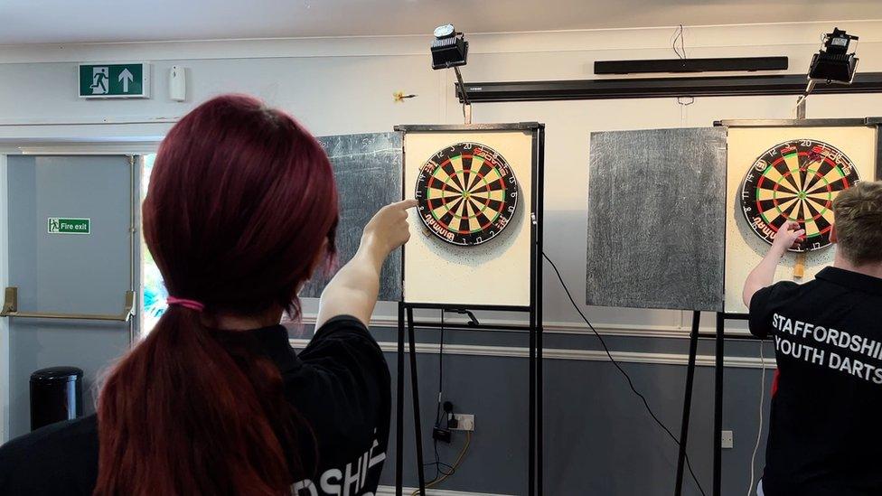 Young darts player