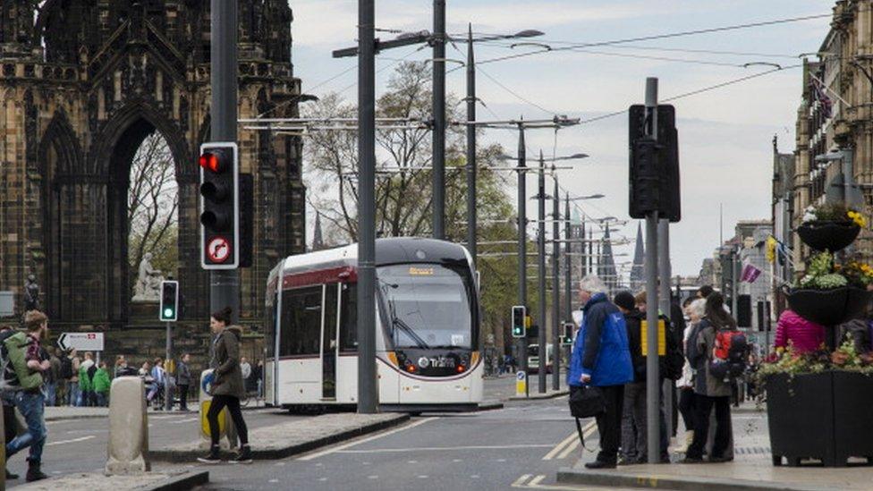 Tram passing Scott's Monument in Edinburgh