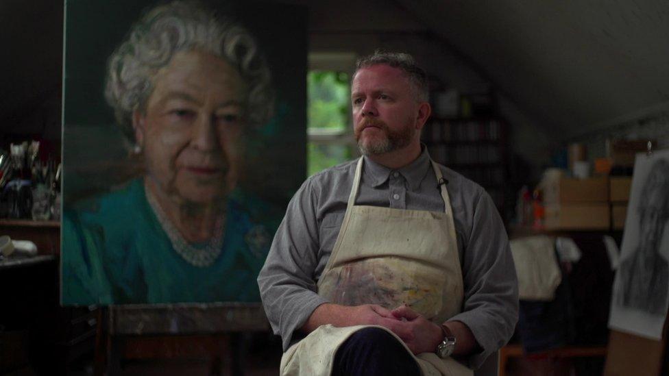 Colin Davidson beside his portrait