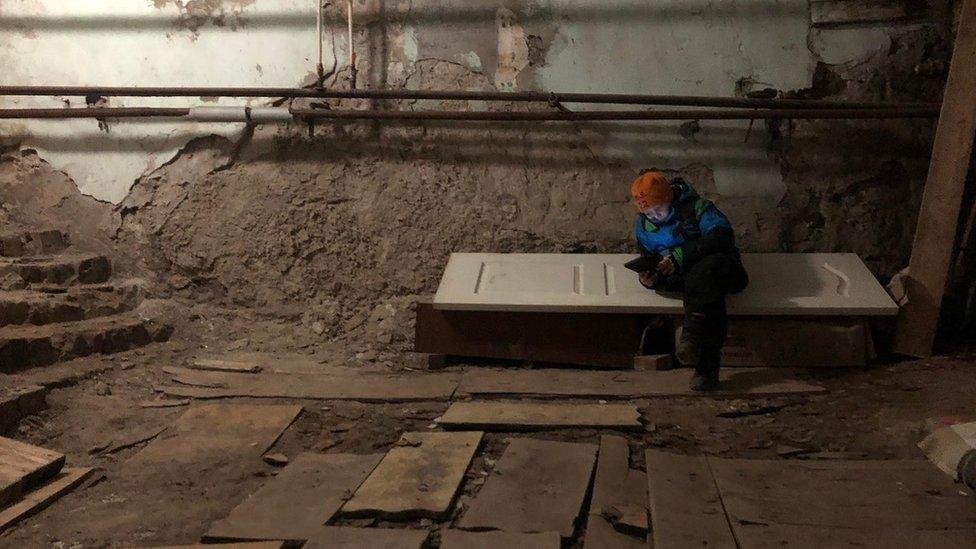 Ukrainian civilians sheltering in basement