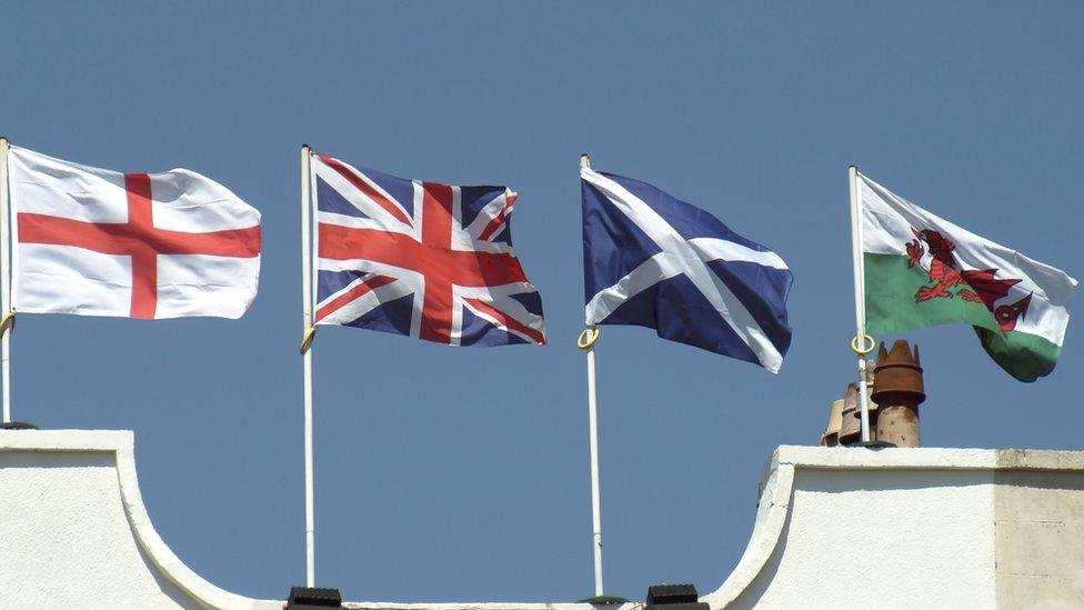 Union flag (wrong way up) with English Welsh Scottish flags