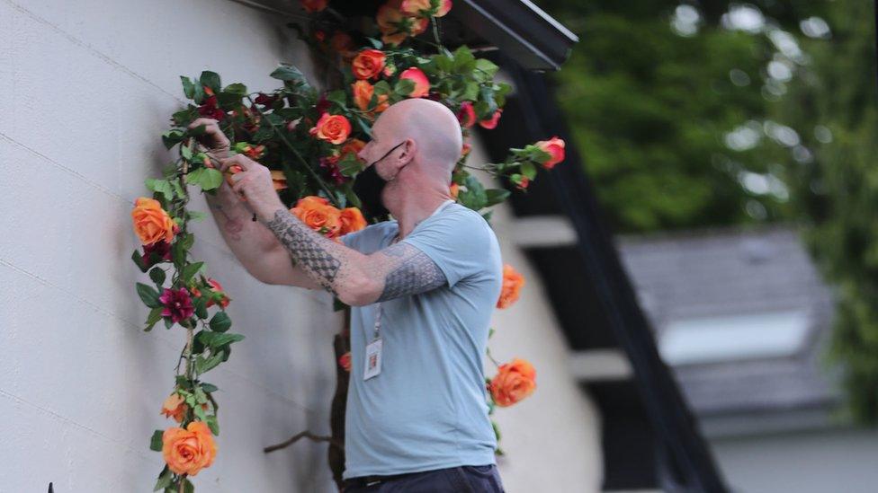 Flowers being added to buildings