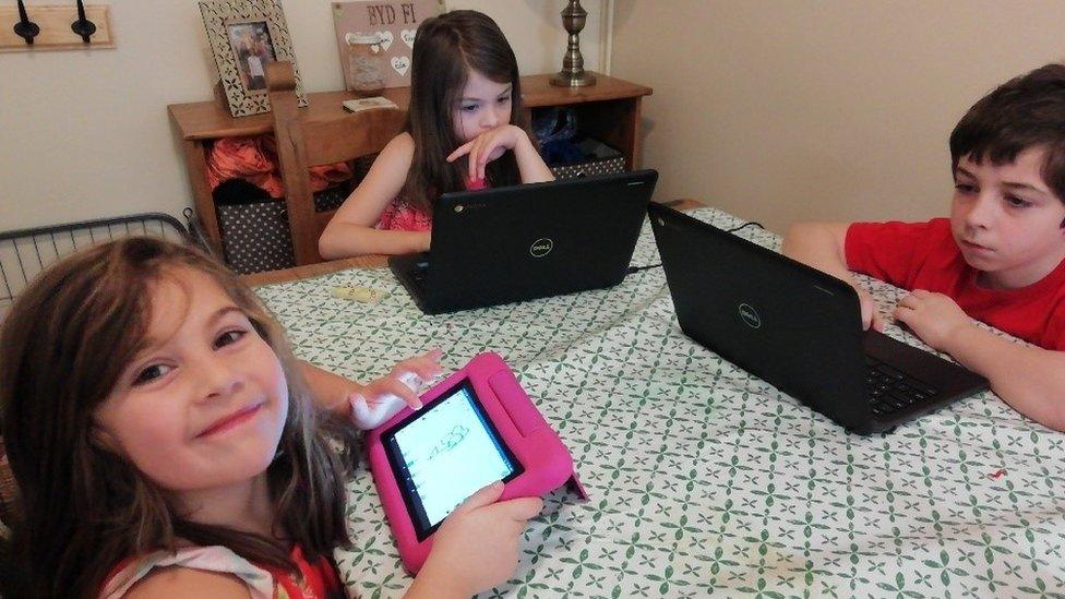 Children working at the kitchen table