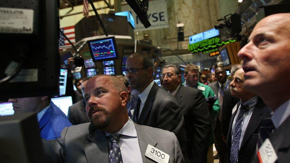 Traders look nervously (nervous, concerned, puzzled, worried, anxious, anxiety) at unfolding events on the floor of the New York Stock Exchange (NYSE) September 16, 2008