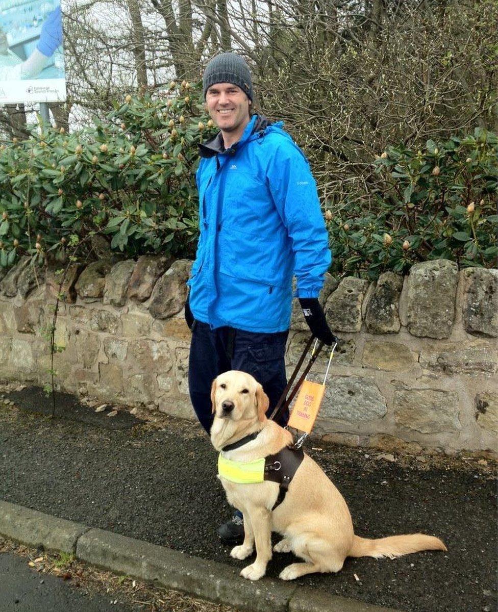 Gavin Neate with guide dog