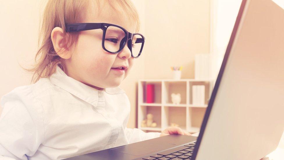 Toddler using laptop