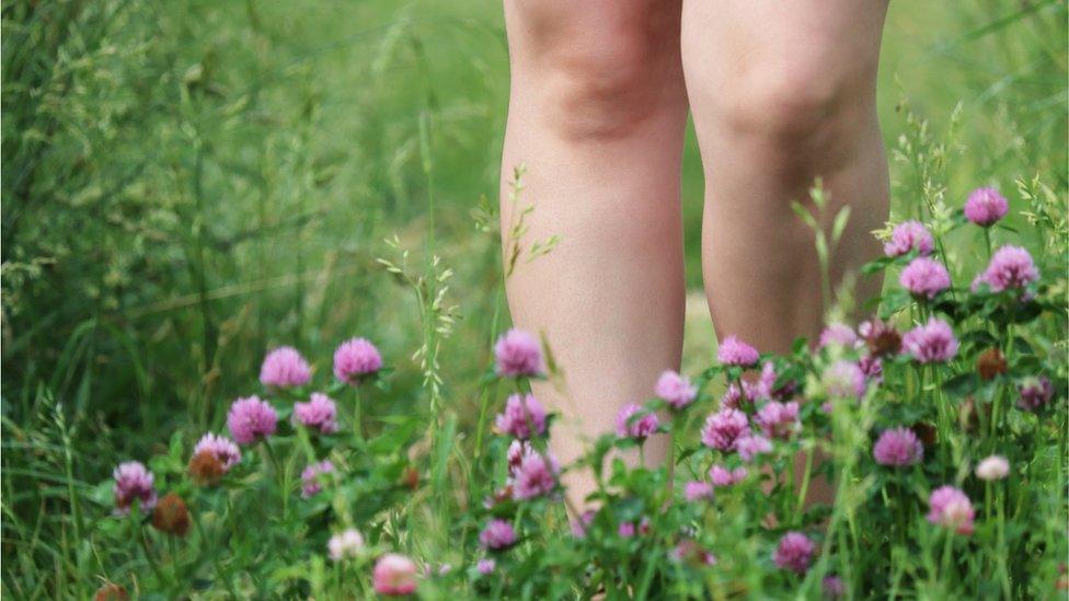 bare legs in the grass