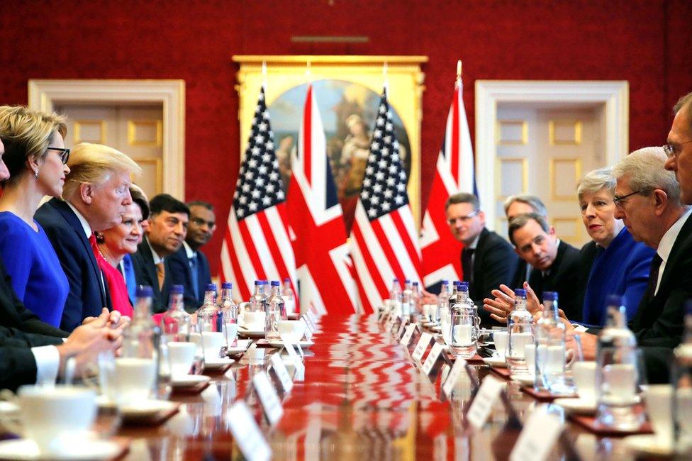 Mr Trump with Theresa May and others at a table