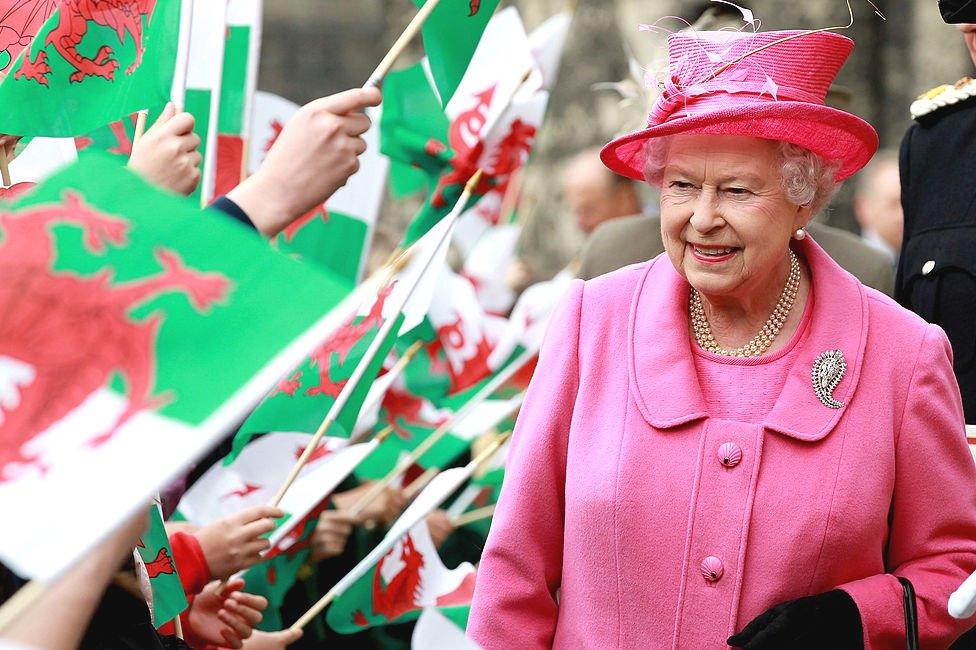 Queen Elizabeth II was cheered by school children with flags as she arrived at Caernarfon Castle in 2010