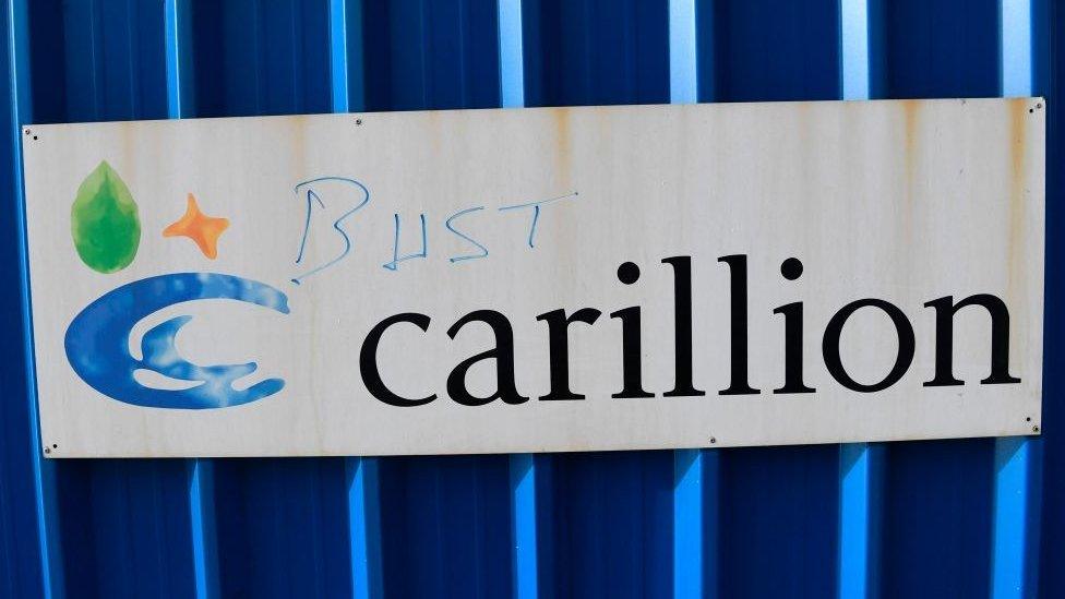 defaced Carillion sign