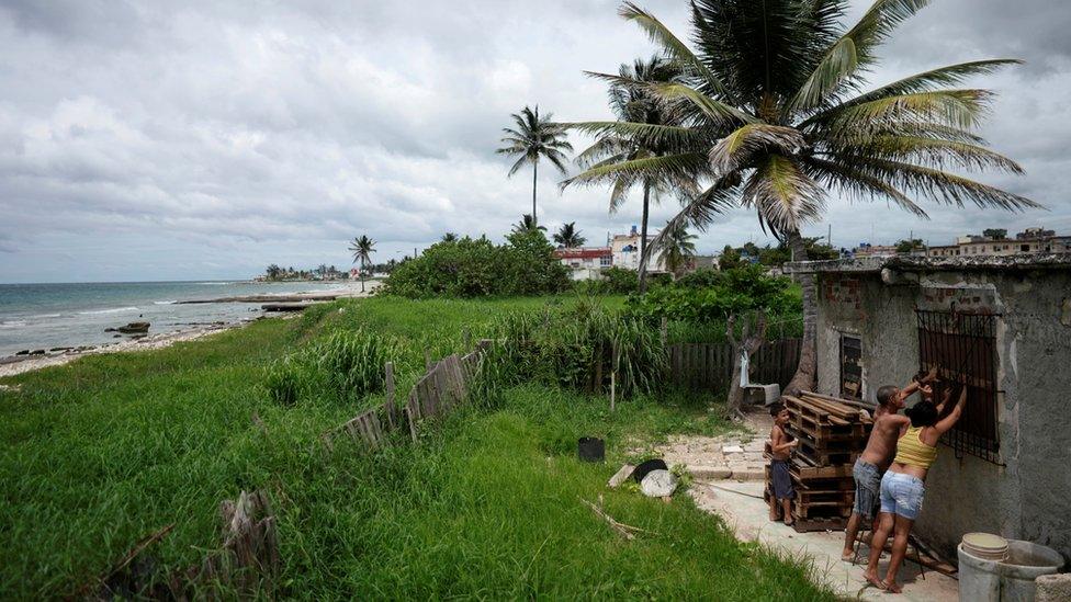 A couple preparing for the storm in Guanabo, Cuba