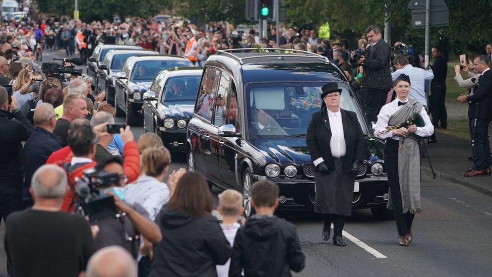 The funeral cortege arrives in Ashington greeted by well-wishers