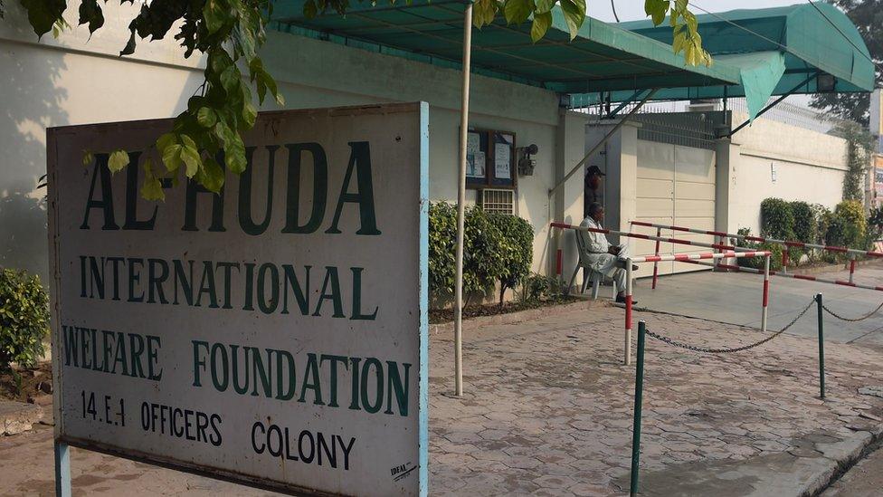 Pakistani private security personnel guard the main entrance of the Al-Huda Institute, one of the most high-profile female seminaries (Islamic religious school), in Multan on December 7, 2015